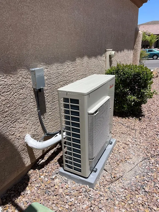 Residential air conditioning condenser unit in Dyer